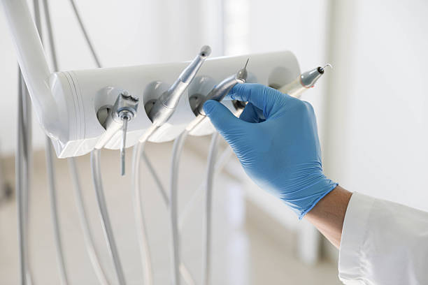 Professional Tooth Extraction technician working in Central City, IL